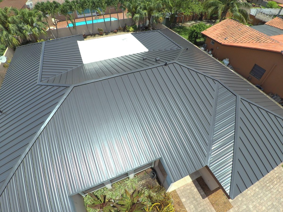 Aerial view of a modern dark grey metal roof on a house.